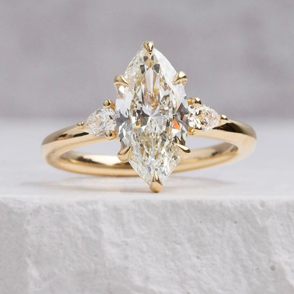 Pear And Marquise Shape Moissanite Three Stone Ring