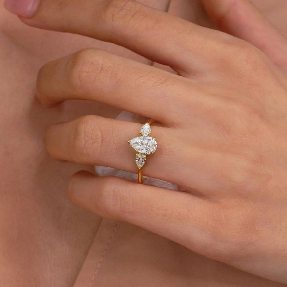 Moissanite Pear Three Stone Ring